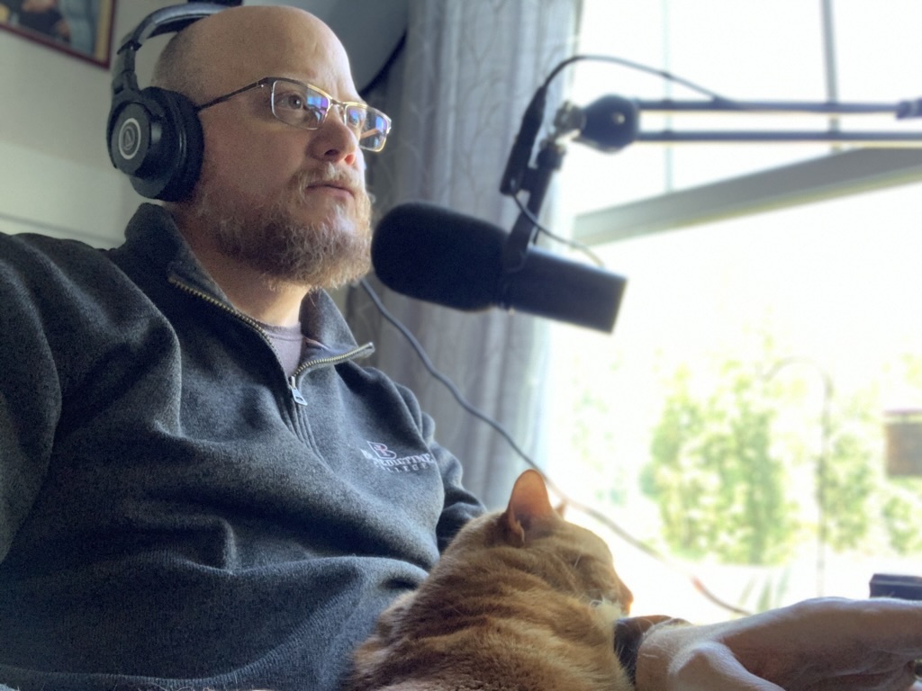 Greg Willits recording at a microphone